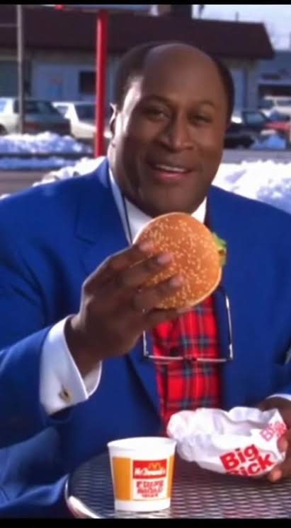 Cleo McDowell proudly holding a burger