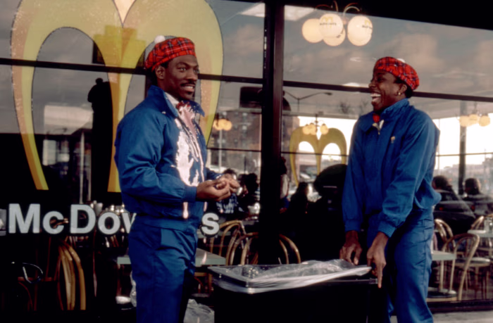 Akeem and Semmi sharing a laugh while working at McDowell’s